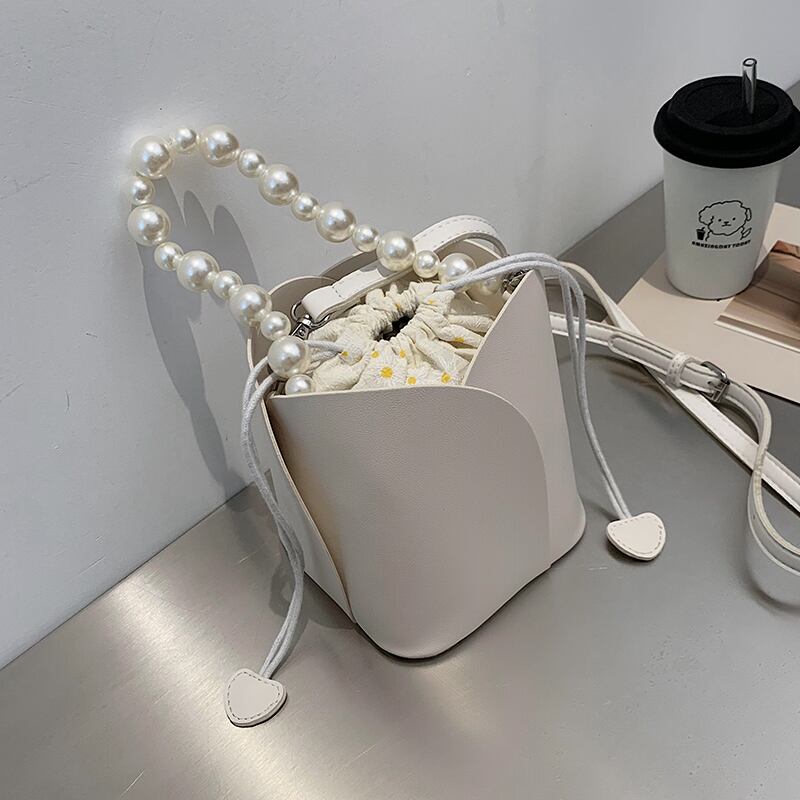 フランスのニッチなレディースバッグ2020夏人気の新しい流行のファッションテクスチャメッセンジャーネットセレブワイルドバケットバッグ 手作りハンドバック12059113715