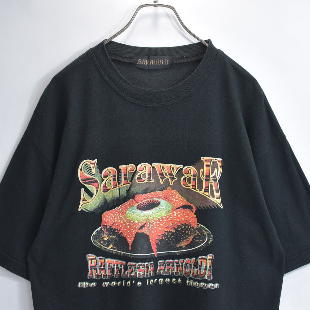 90~00s SARAWAK フラワープリント ラフレシア グラフィック デザイン プリント スーベニア 半袖 Tシャツ 花 ブラック ヴィンテージ ビンテージ 古着 メンズL相当