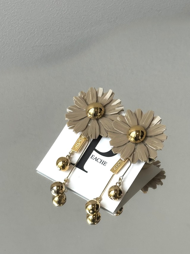 beige flower gold metal bon bon swing