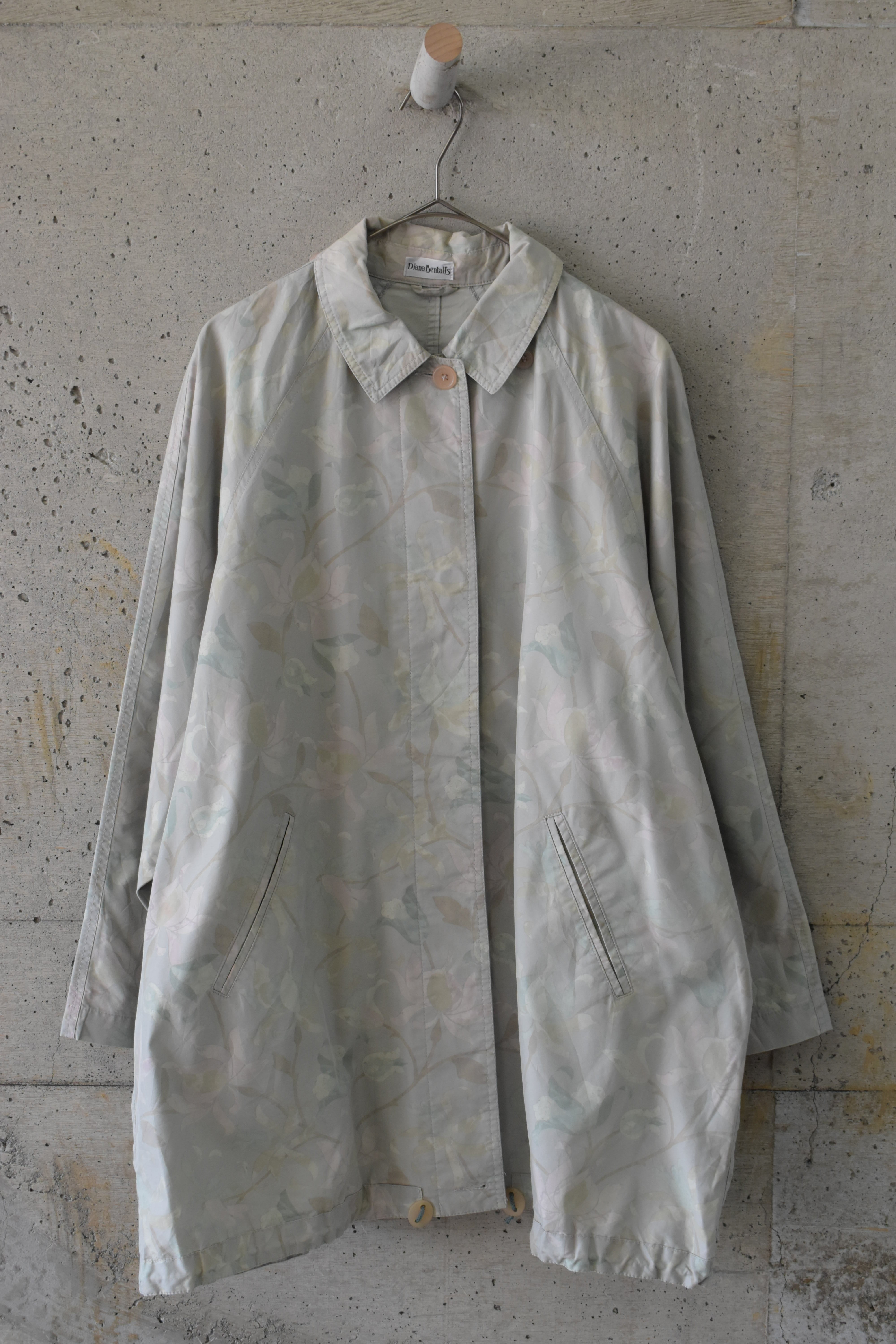 Large floral print pale tone coat