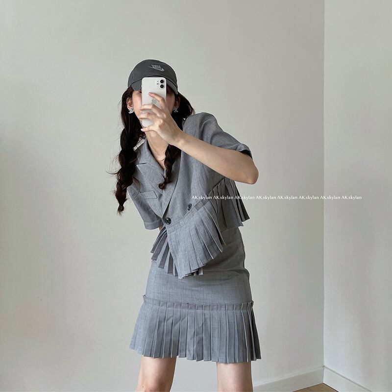 プリーツボタンカジュアルジャケット サマーソリッド カラーショートスカート 夏物 ソリッドカラー ビッグFスモールZ韓国43423237555