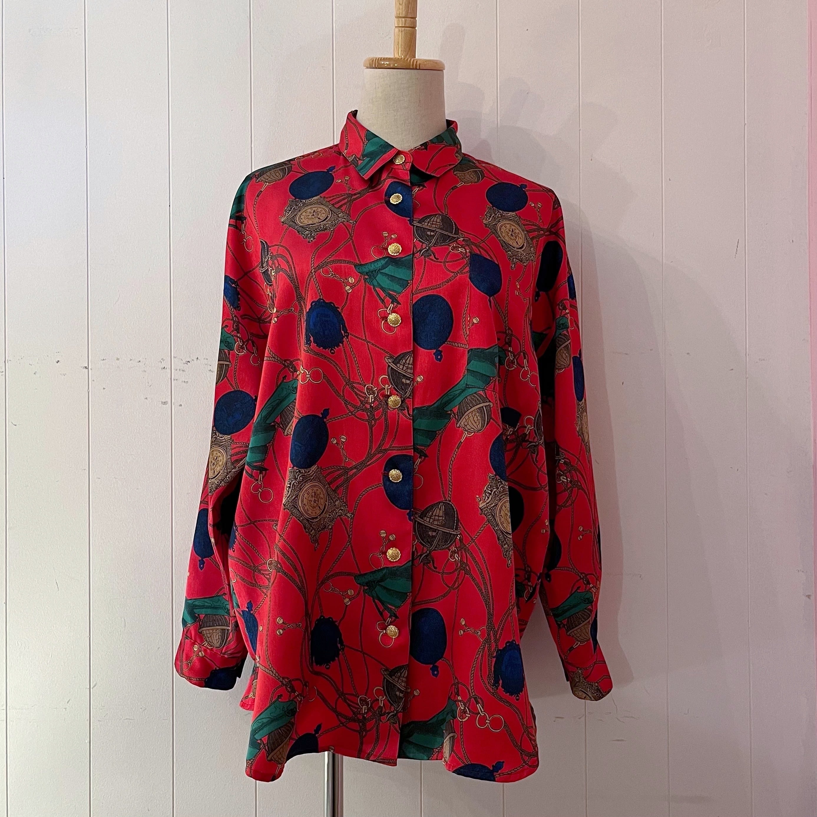 clock and globe red satin blouse