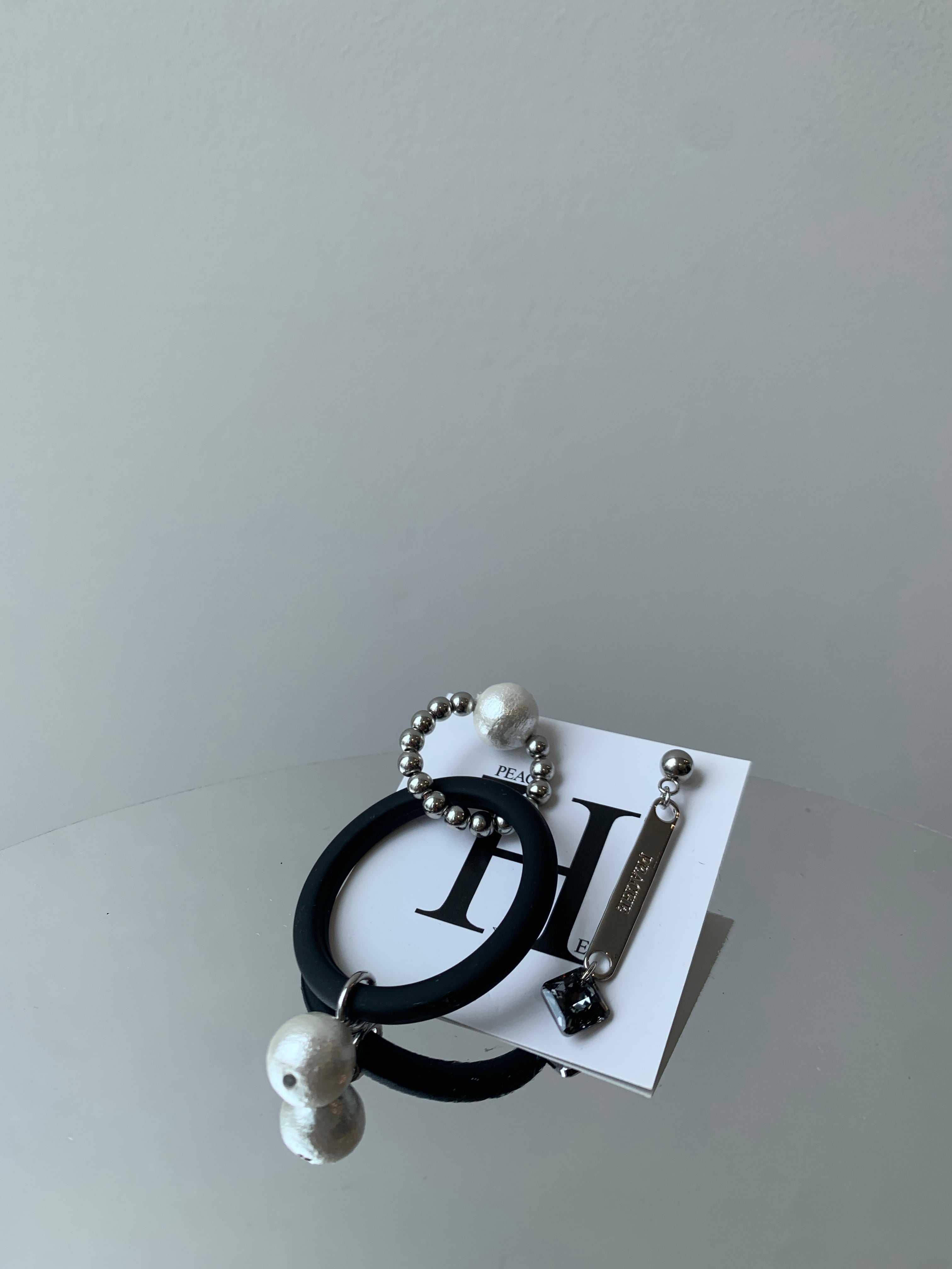 mat black circle pearl asymmetry