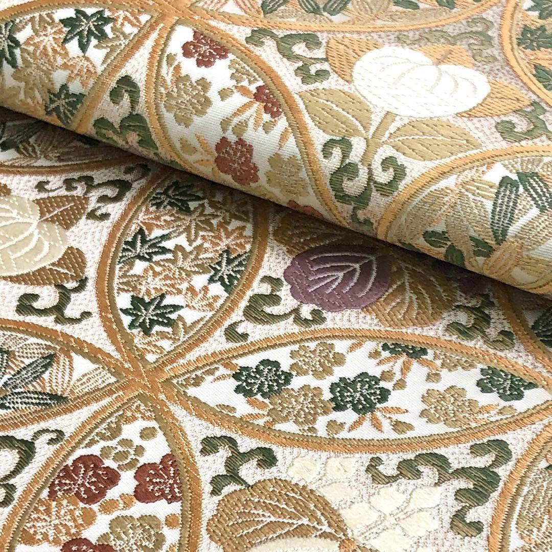 袋帯 隆盛宝華文 花七宝繋ぎ 花唐草 金糸 胡粉色 O-3490 | リユース  