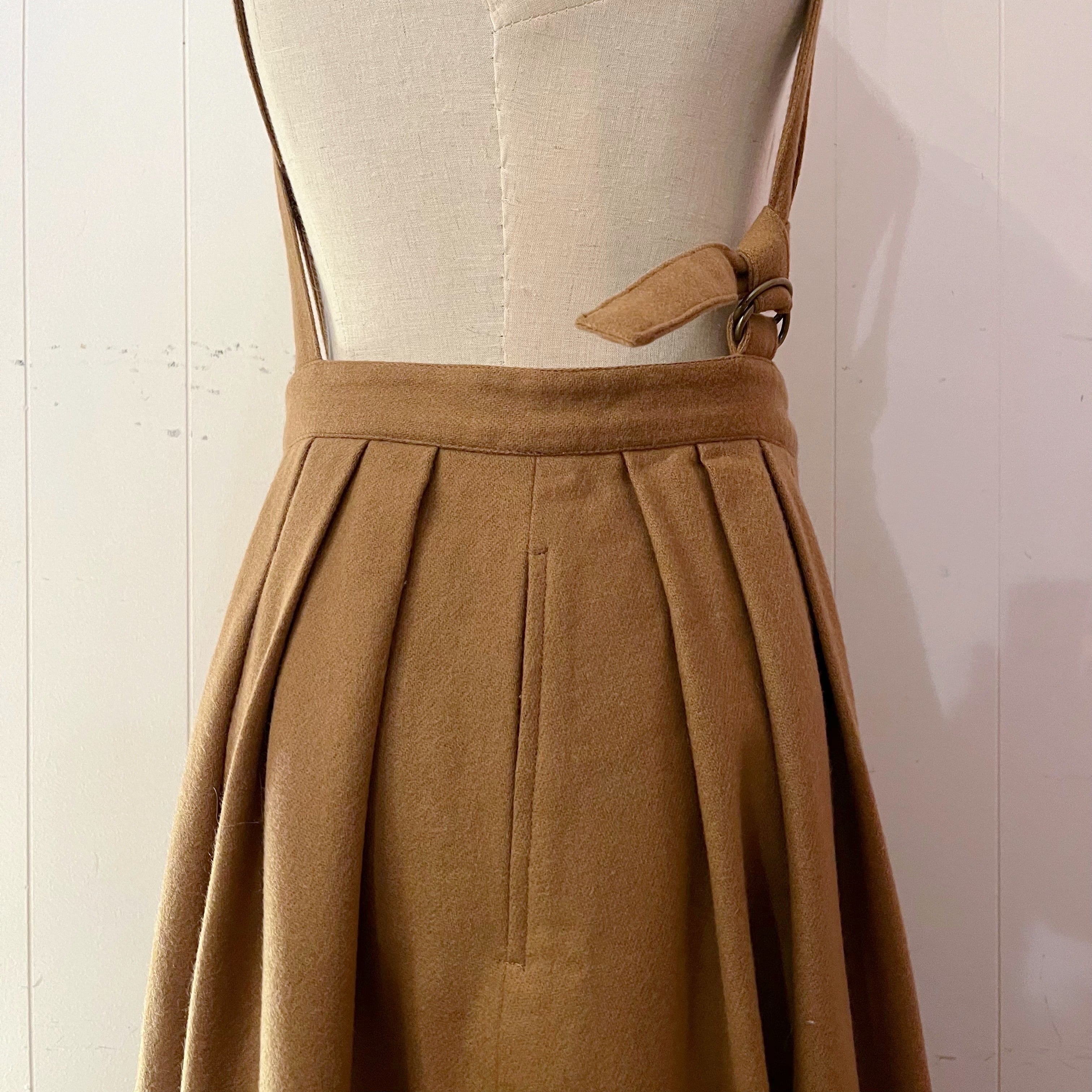 beige front button suspender skirt