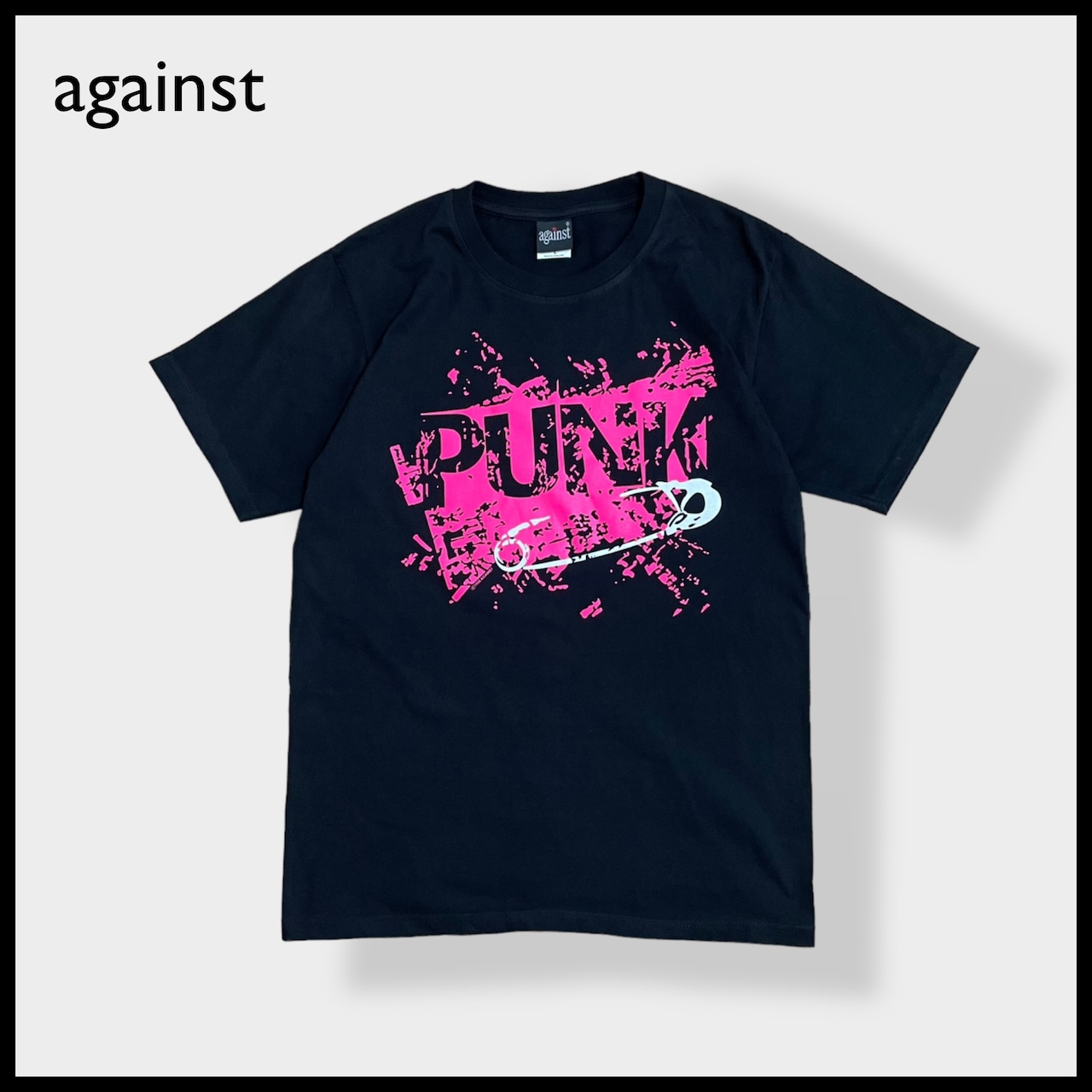 【against】PUNK ロゴ プリントTシャツ バンドTシャツパンク ピンク 黒 バンt ロックt 音楽系 アゲインスト L US古着