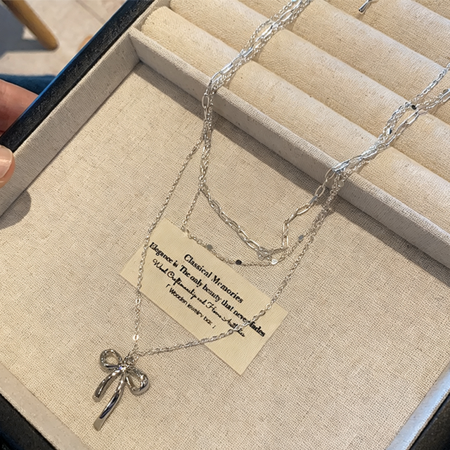 Before３層重ねリボンネックレス