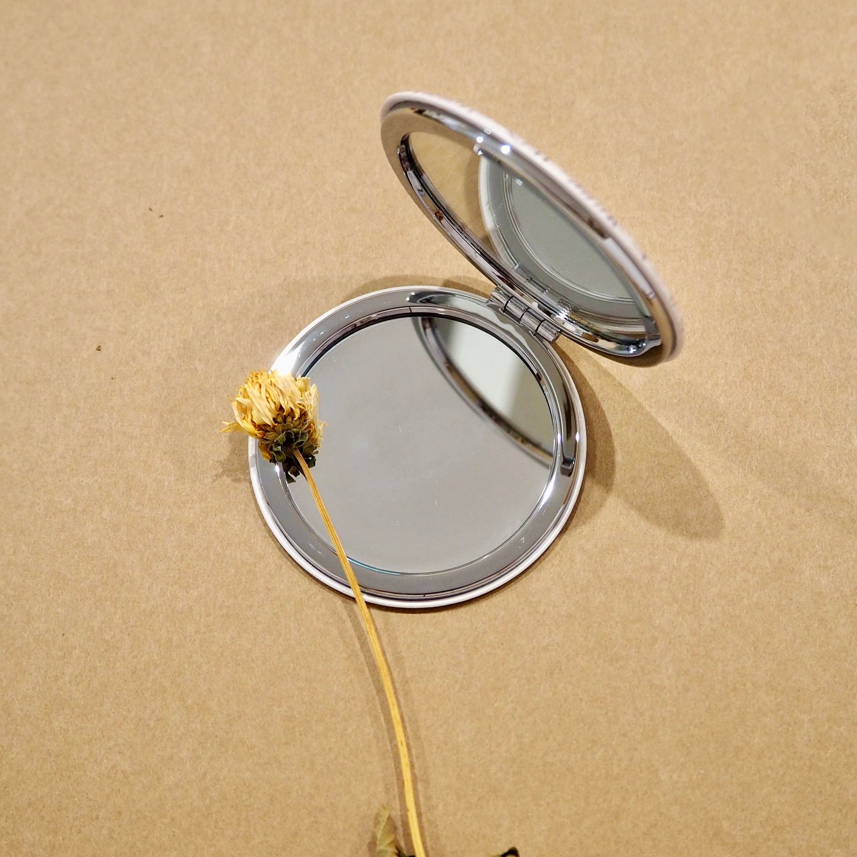 her compact mirror