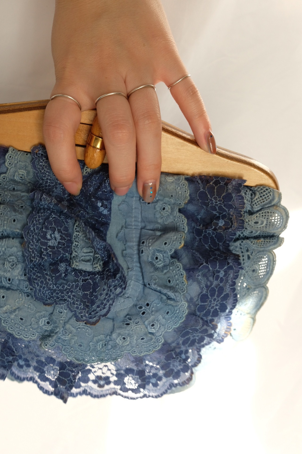 Laced design clutch bag