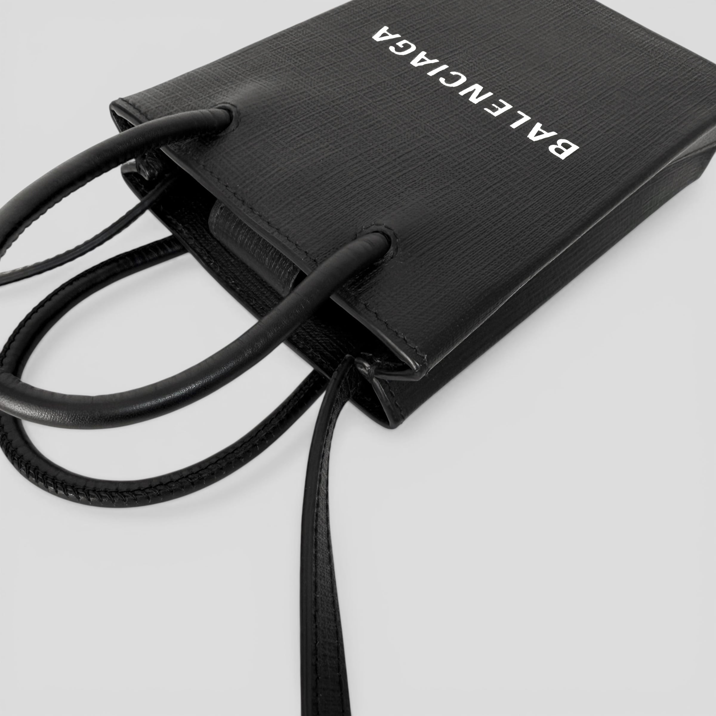 BALENCIAGA Shopping Phone Holder Black | BRAND RESORT Online