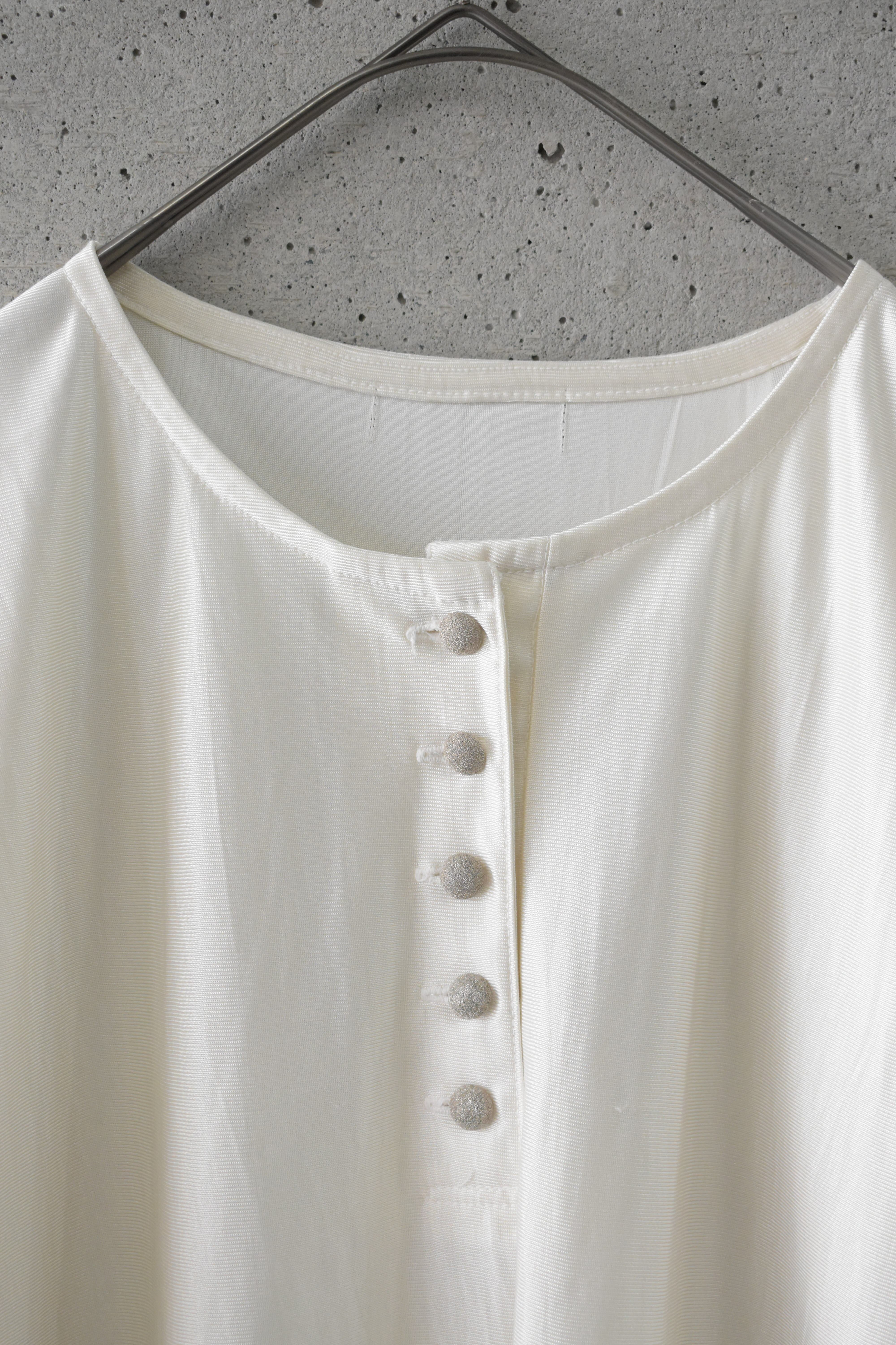 Shiny, flowy half-button top