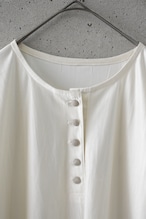 Shiny, flowy half-button top