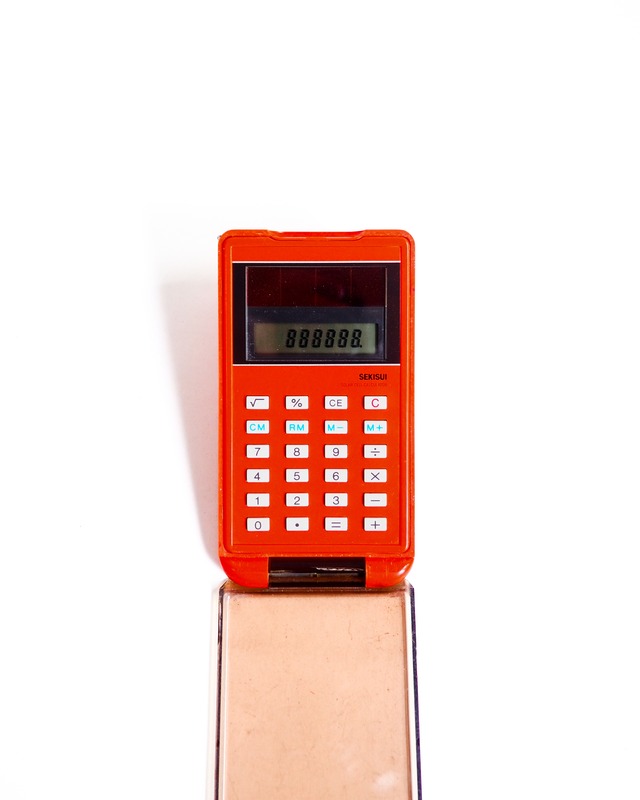 Orange measuring tape & calculator