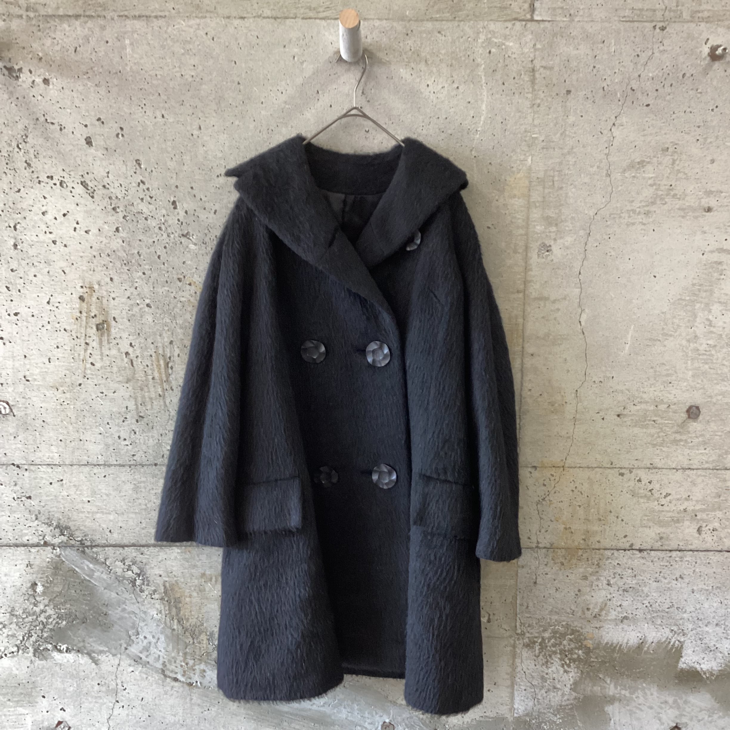 A long-haired coat with large buttons