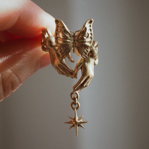 brass ring of spherically-articulated dolls