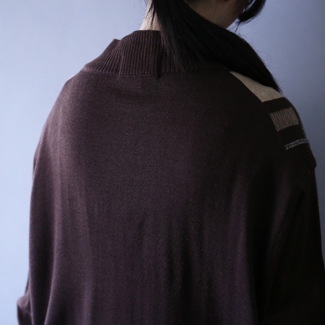 3D knitting pattern over silhouette half-zip sweater
