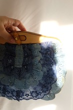 Laced design clutch bag