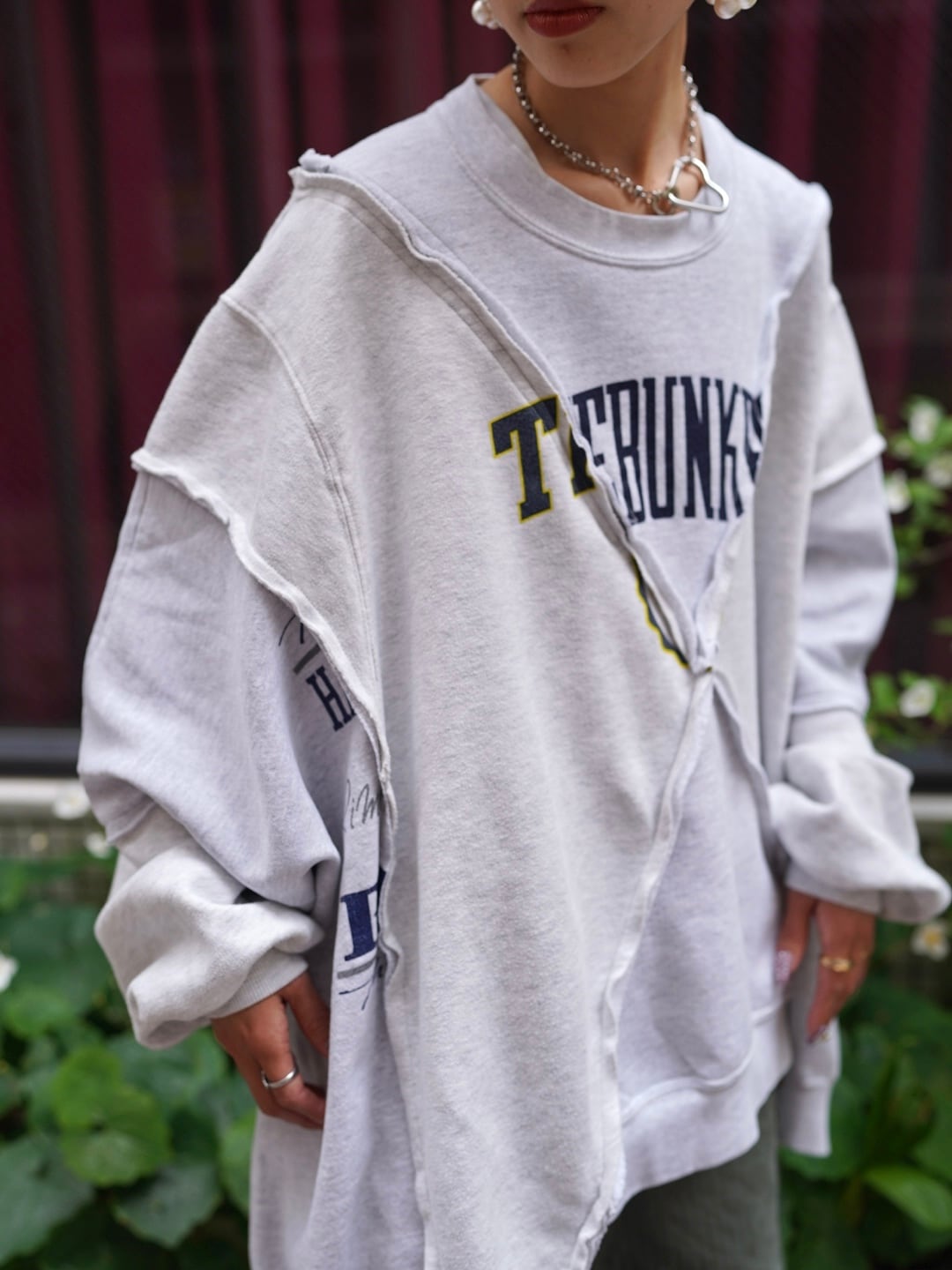 77circa (77サーカ) “circa make cross cutback wide print sweat top”