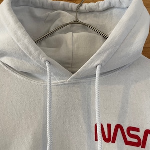 【RIOTSOCIETY】USA製 NASA ロゴ ワンポイント バックプリント 袖プリント 星条旗 プルオーバー パーカー US古着