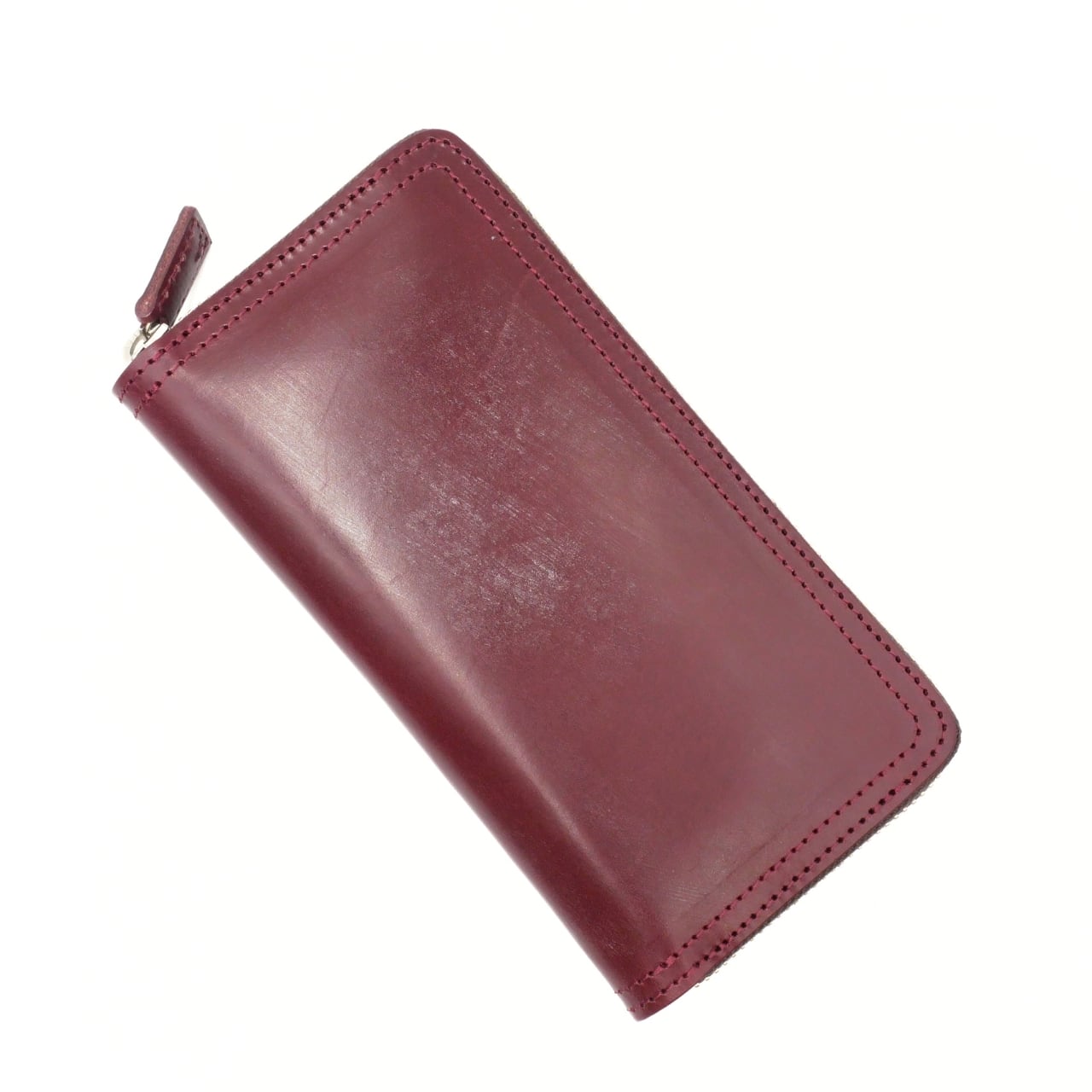 ブライドルレザーを使ったスリムなラウンドジップウォレット HANDSOME