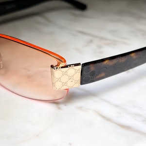 GUCCI half-rim glasses with orange color lens