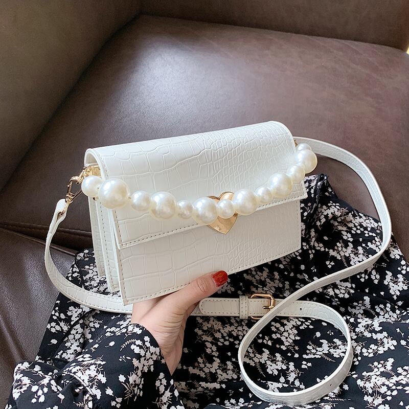 小さなバッグ女性バッグ2020新しい波夏のファッションパールショルダーメッセンジャーバッグエインワイルドテクスチャ小さな正方形バッグ Tiancai_Wing_Bag9237908