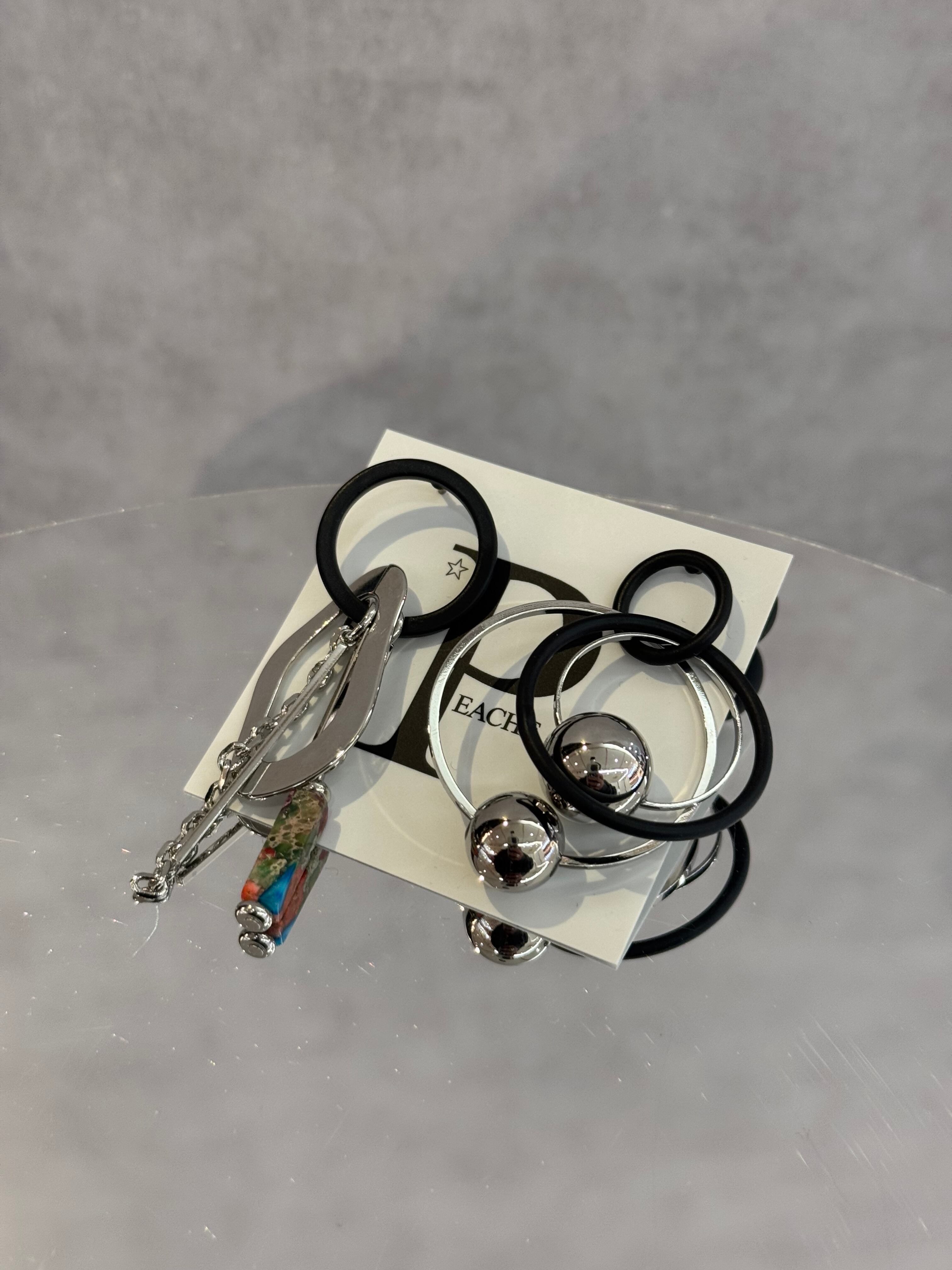 black silver ring overlap asymmetry