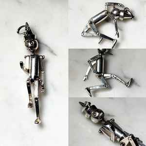 vintage 1970’s UNOAERRE silver figure pendant