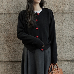 black cardigan with chic heart buttons