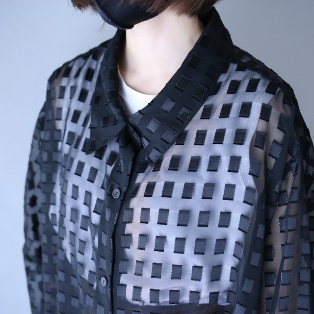 block pattern XXX over silhouette black see-through shirt