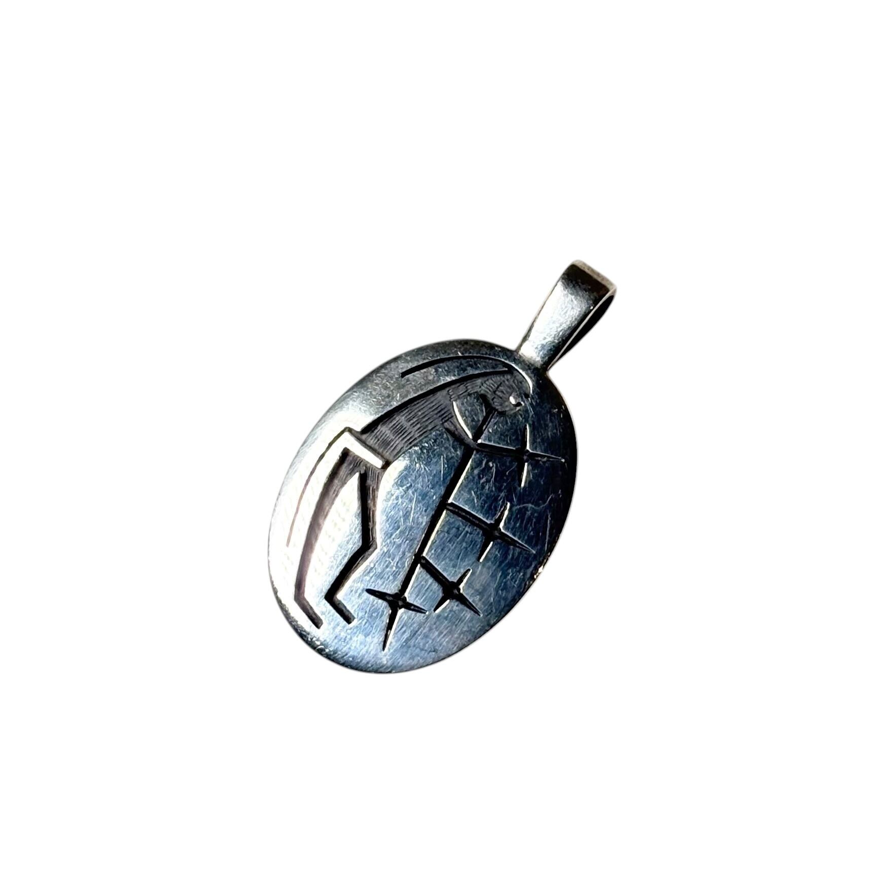 Hopi Ricky Coochwytewa silver overlay pendant “Starblowers” | NOIR