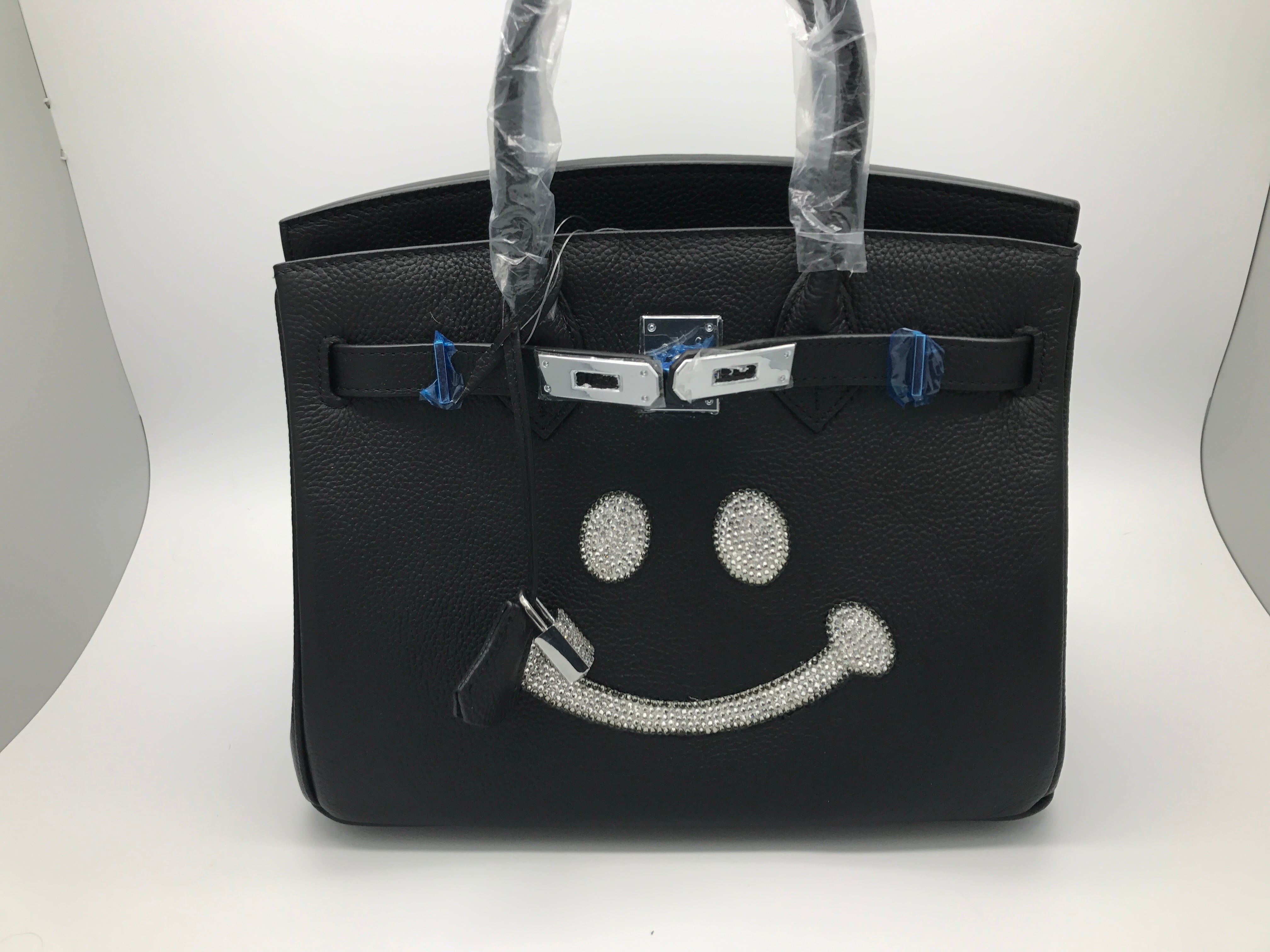 美品ニコちゃんマークのキラキラバーキン型バッグ