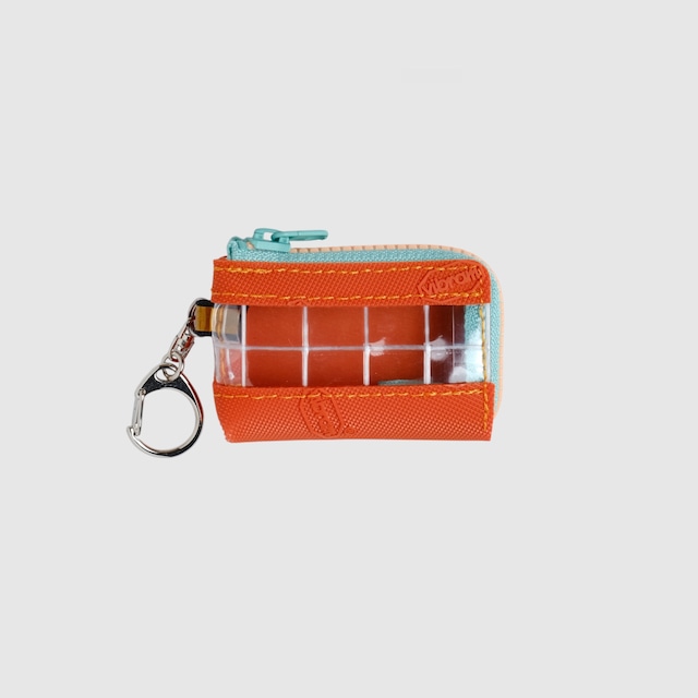 vibram coin pouch keychain (orange×clear) with orange glowing zip