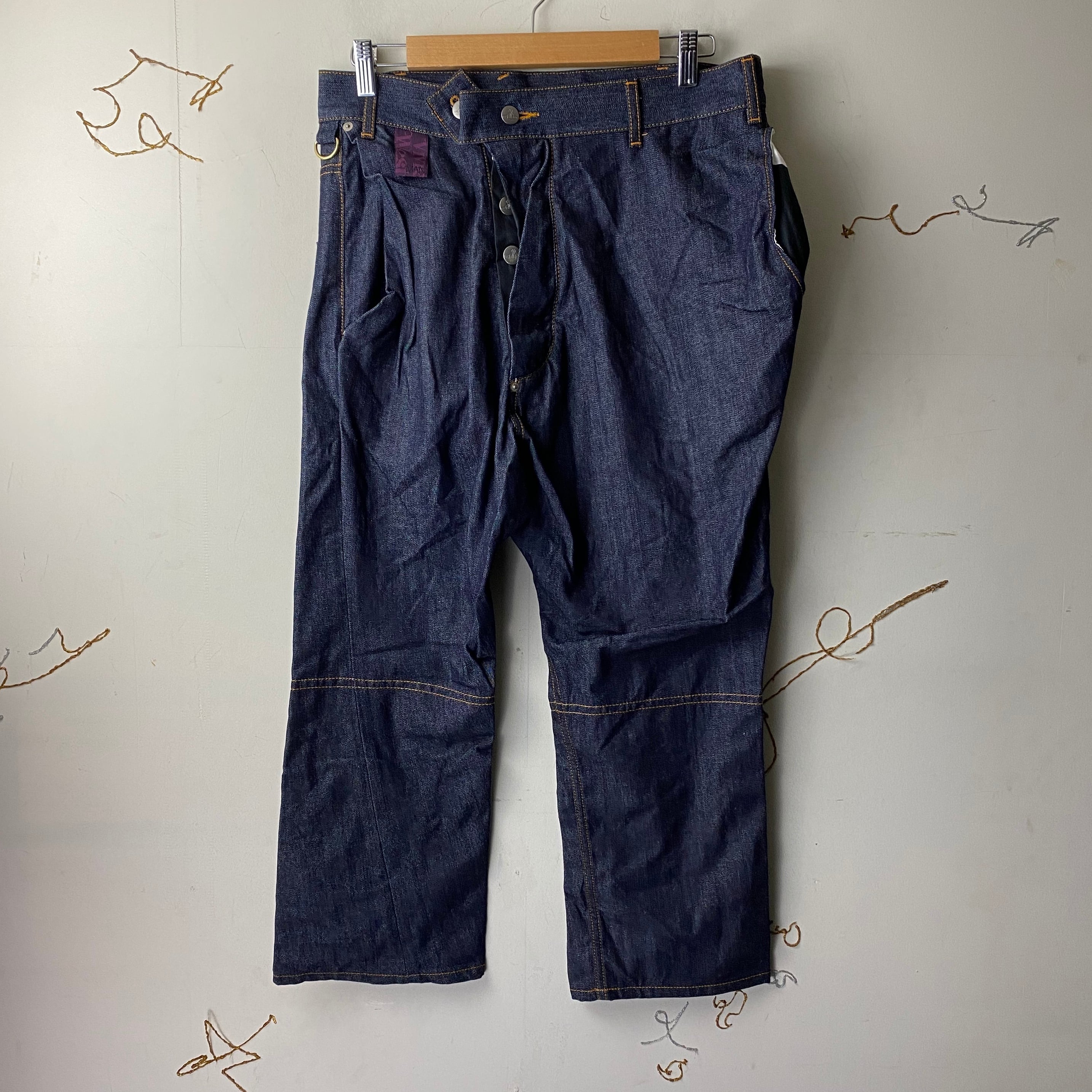 VIVIENNE WESTWOOD MAN asymmetric denim pants | NOIR ONLINE