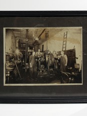Photographs of factory workers and matted paper from the "early 1900s"