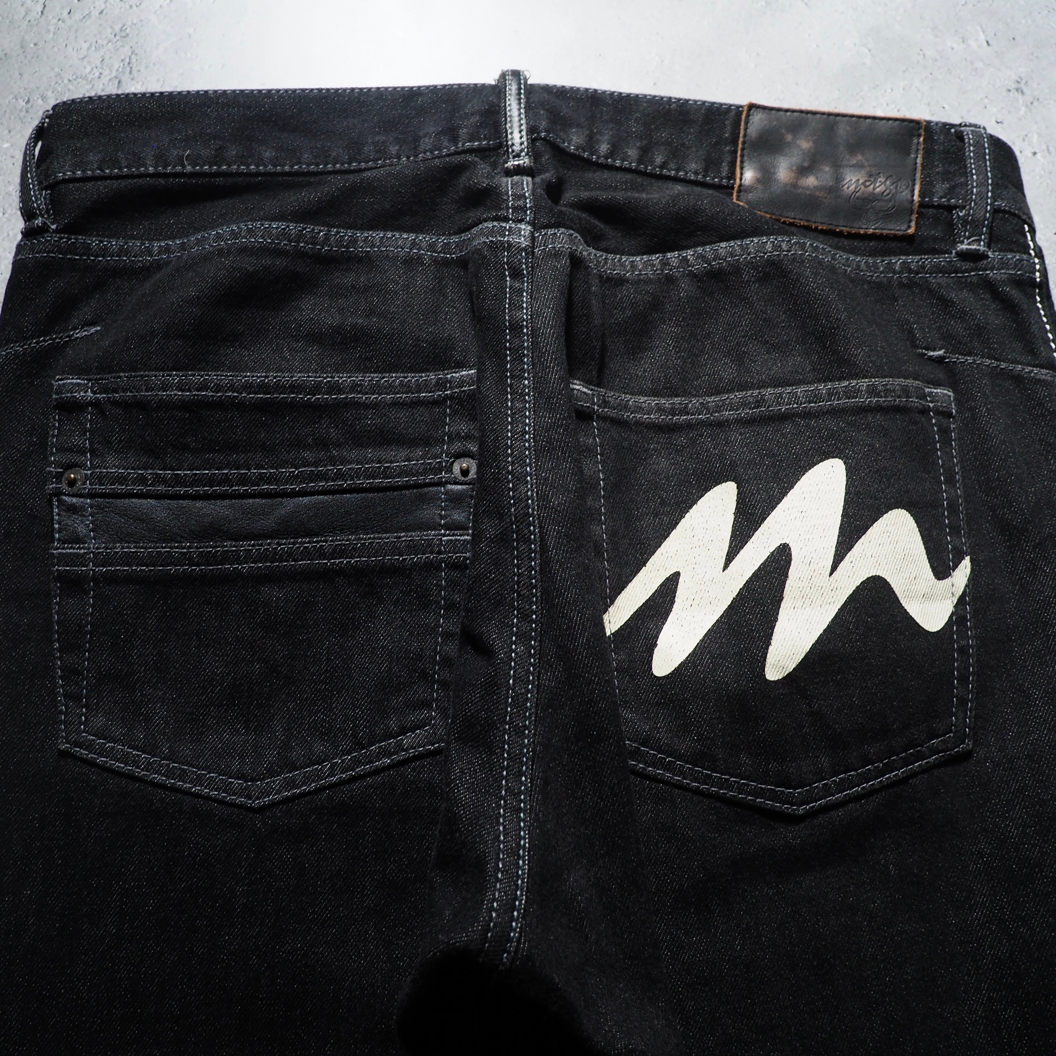 ” Montage ” Back logo painted Black loose Buggy Denim pants