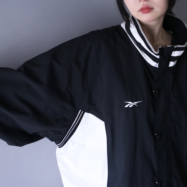 "Reebok" monotone coloring over silhouette mountain jacket