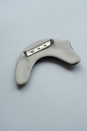 Handmade ceramic crescent cat brooch