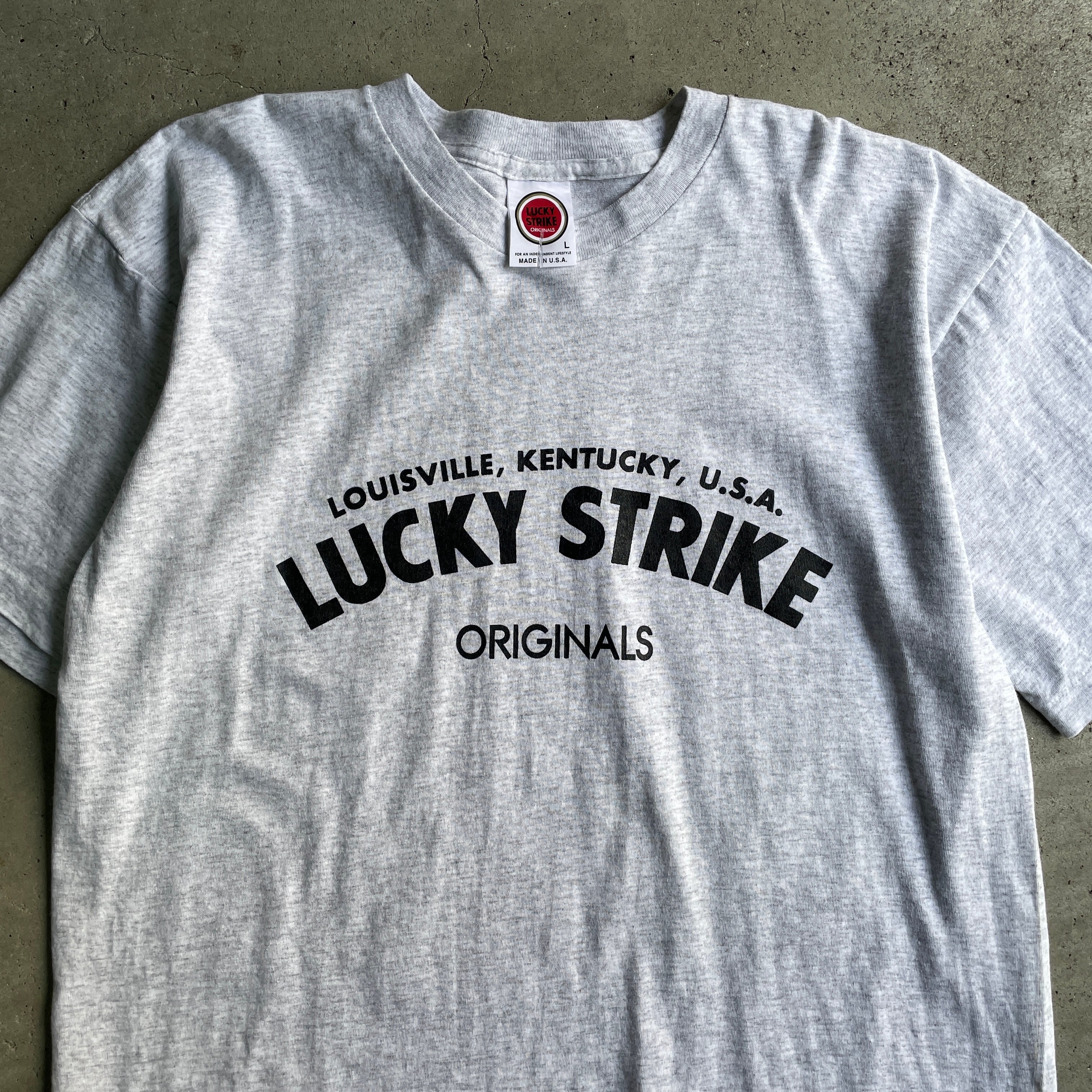 USA製 90年代 ”LUCKY STRIKE” 企業 オリジナル アドバタイジングTシャツ メンズL 古着 ラッキーストライク タバコ 煙草  プリントTシャツ 90s ヴィンテージ ビンテージ シングルステッチ 霜降りグレー【Tシャツ】【23T】 | cave 古着屋【公式】古着通販サイト