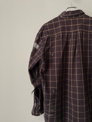 Worn-out checked shirt