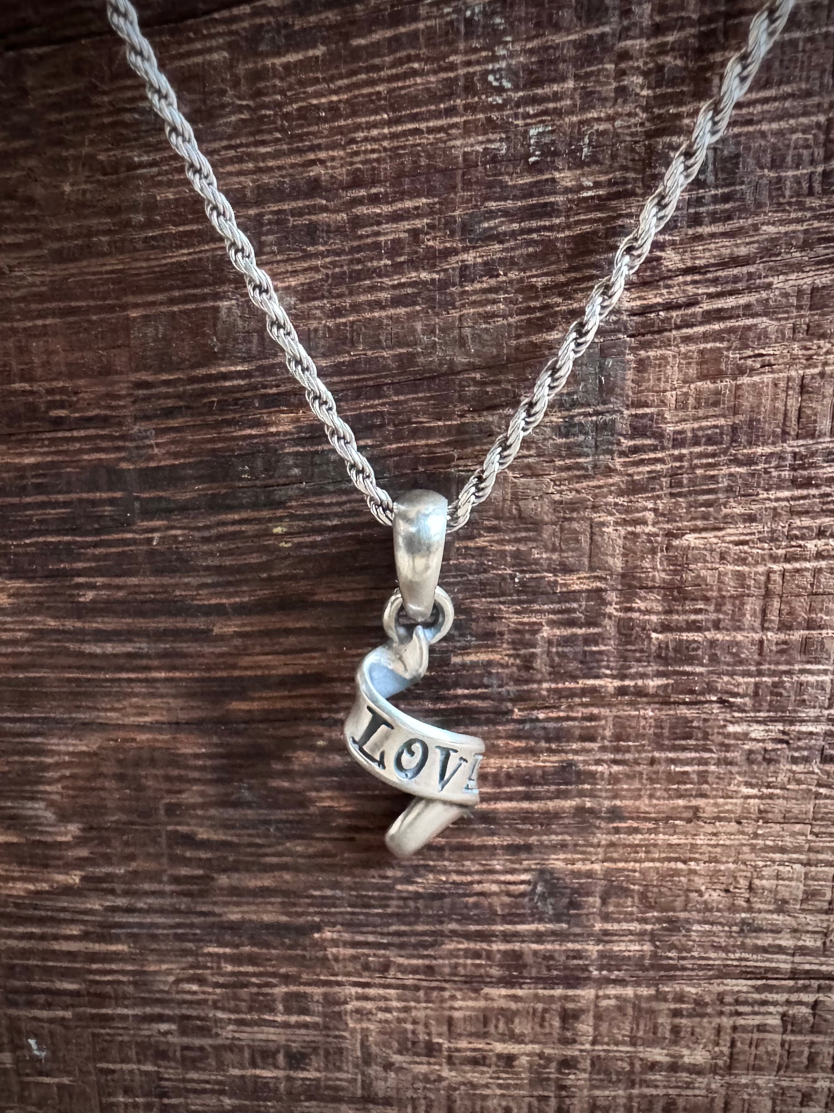 ローリーロドキン ラブアンドヘイト のダイヤクロスペンダントトップ