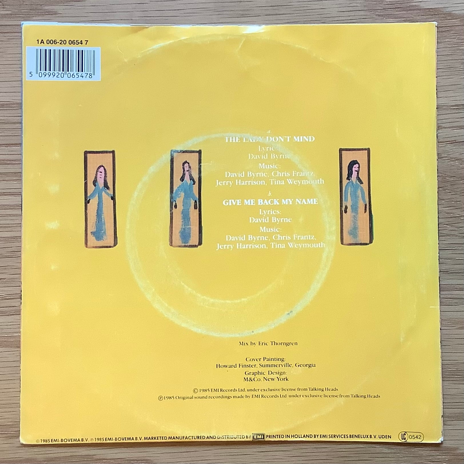 TALKING HEADS / A: THE LADY DON'T MIND / B: GIVE ME BACK MY NAME
