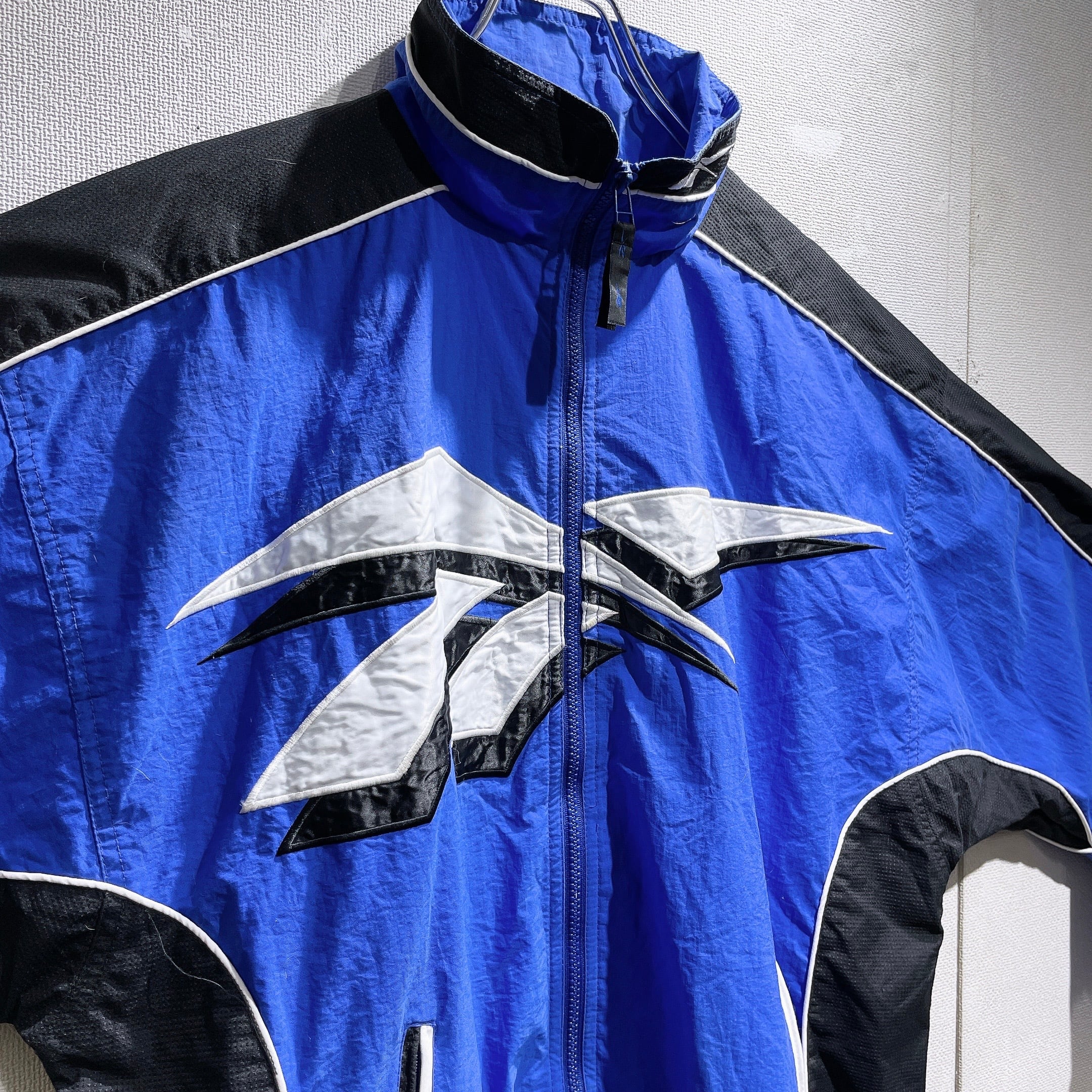 1990s ” Old Reebok ” Big vector logo Embbossed vintage Track jacket