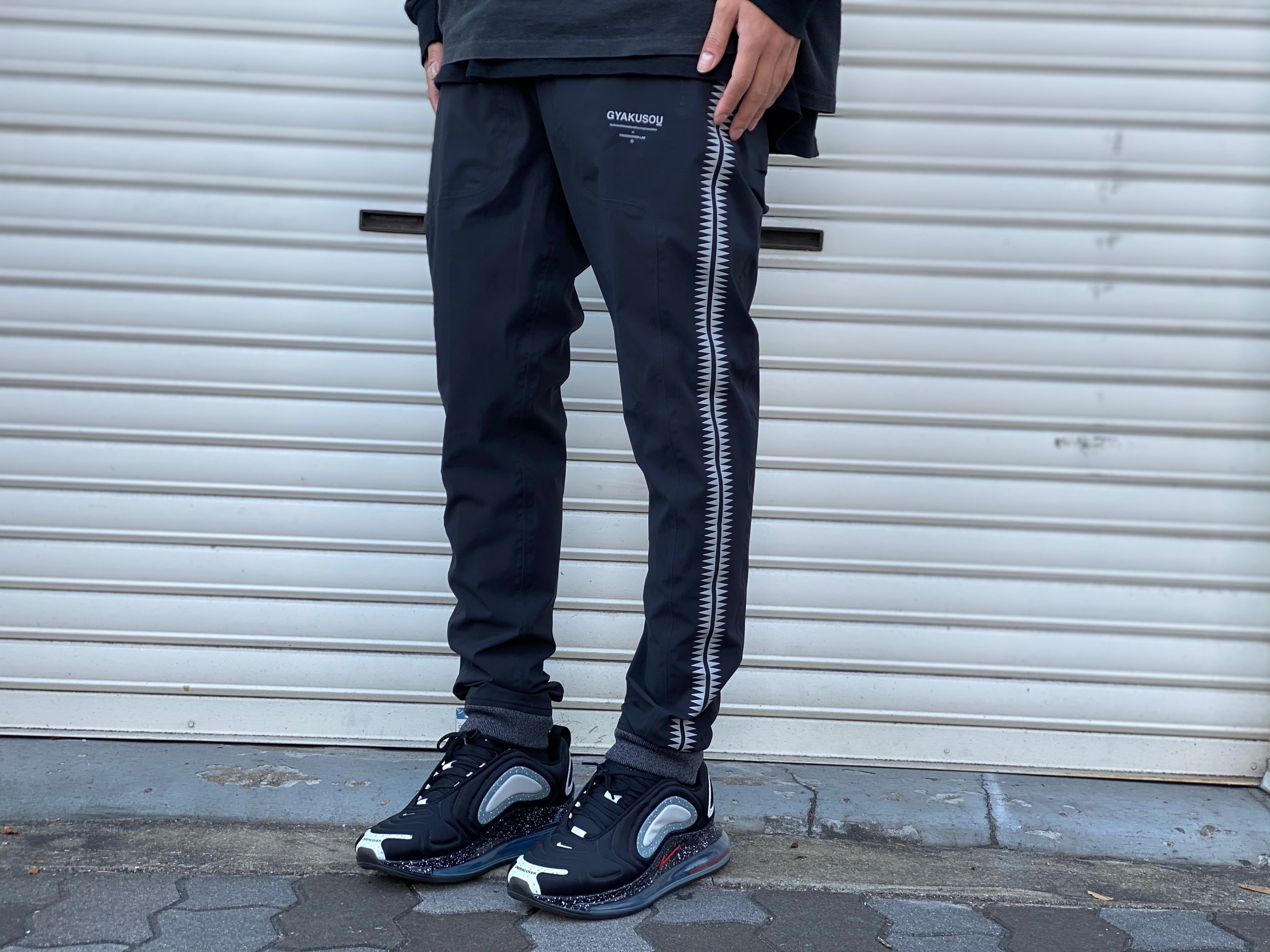 ナイキ ×アンダーカバー UNDERCOVER 842794-010/WR TEAM TRACK PANT BLACK ギャクソウGIZ柄ウォームアップトラックロングパンツ メンズ M