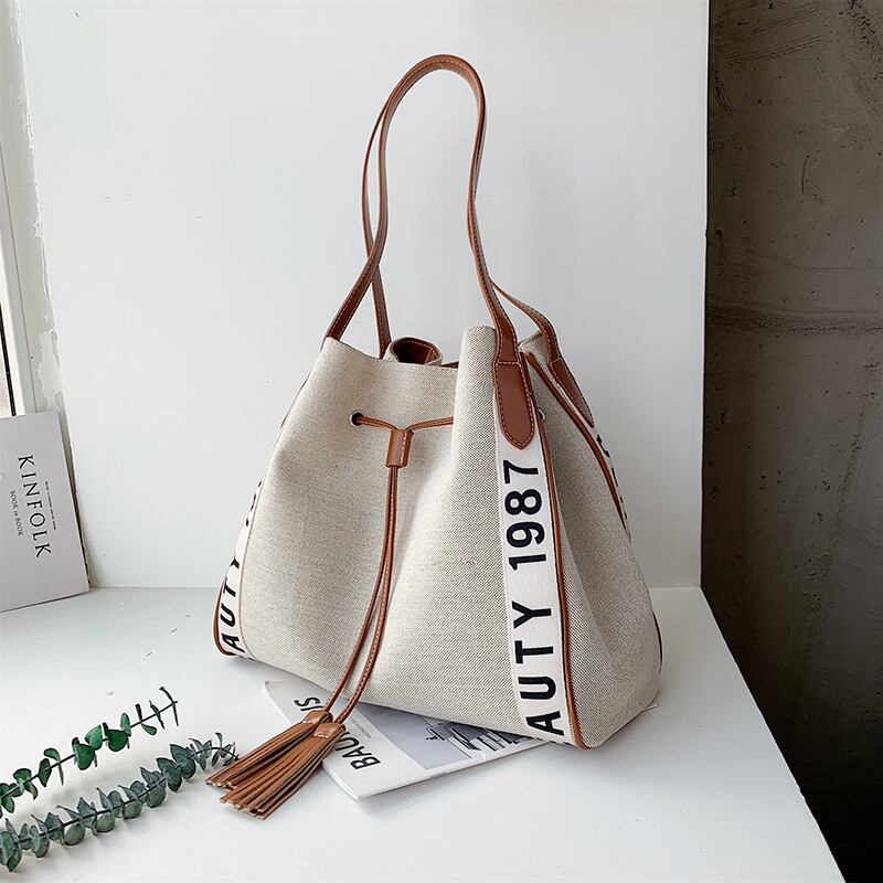 バッグレディースバッグ2020夏の新トレンドライン大容量ワイルドショルダーバッグインエインキャンバストートバッグ Tiancai_Wing_Bag2584268