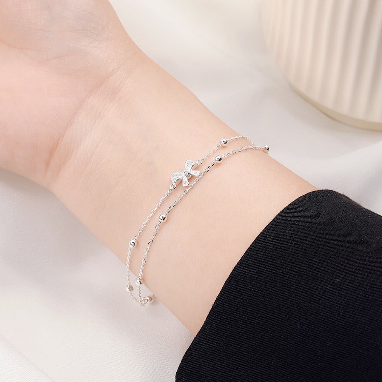 おしゃれ キラキラ リボン 鈴 ダブル シルバー ブレスレット | FANCY