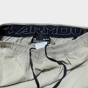 【UNDER ARMOUR】ウインドブレーカーパンツ トレーニングパンツ ジャージ ズボン 裾チャック 裾ジップ ポリエステル ロゴプリント M 蛍光色 アンダーアーマー US古着