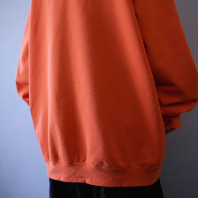 "Carhartt" sleeve logo printed over silhouette orange sweat parka