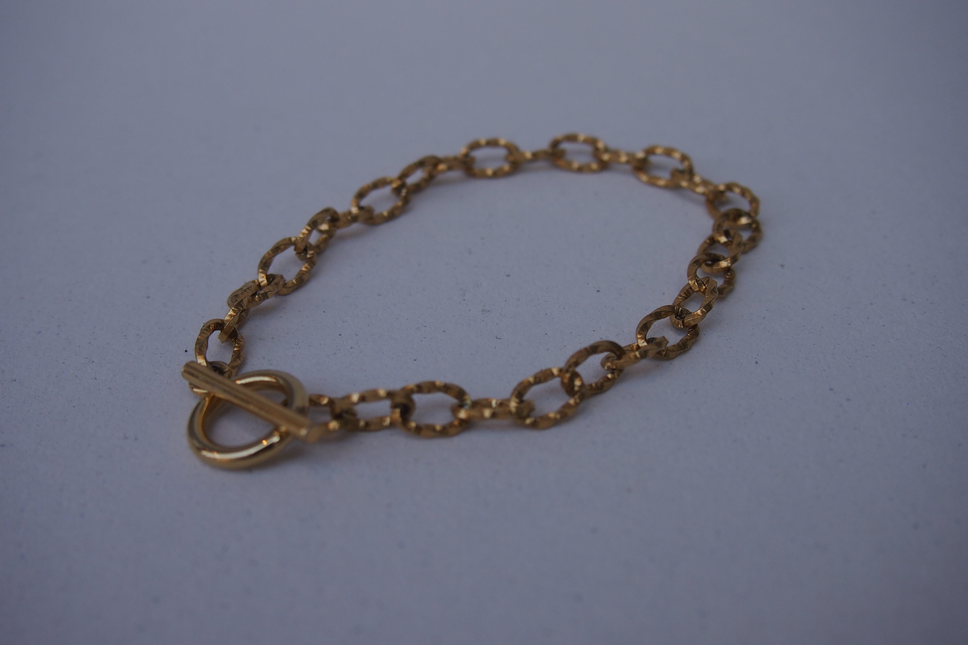 <STAINLESS>TWIST GOLD BRACELET