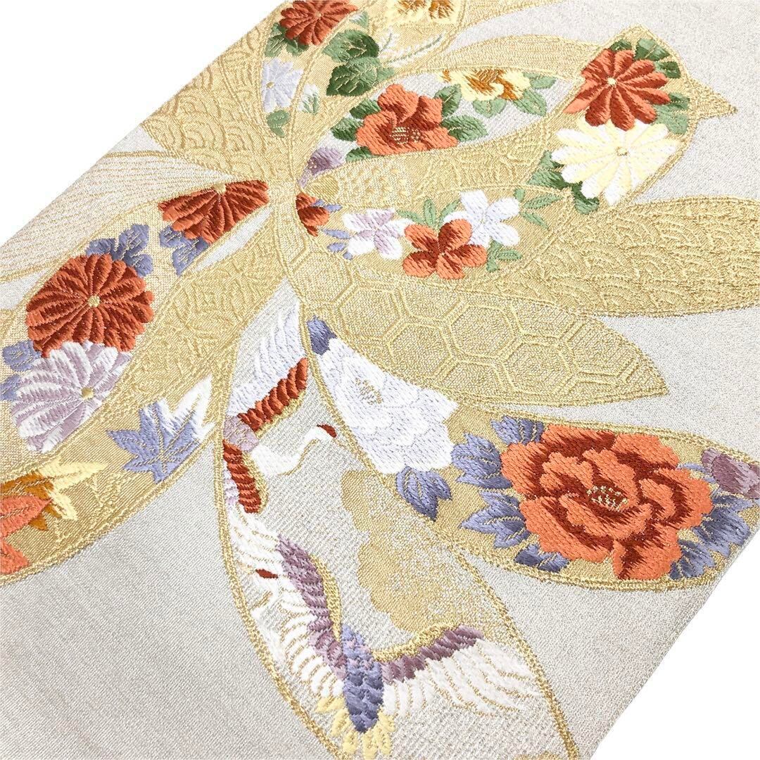 名古屋帯 綴れ織 煌びやかな花模様 鶴 金糸 銀白色 O-3061 | リユース 